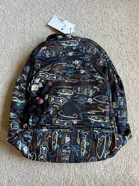Kipling Seoul Black Skateboard Print Backpack with Neon Accents